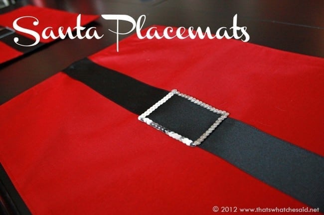 Red placemat with black ribbon and silver trim to look like a santa belt