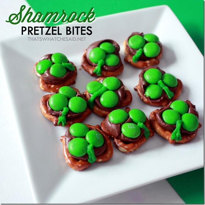 White plate with 9 shamrock pretzels displayed on green background