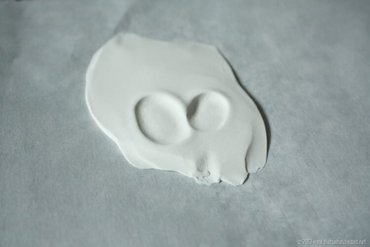 White rolled polymer clay with thumbprints press in v shapen