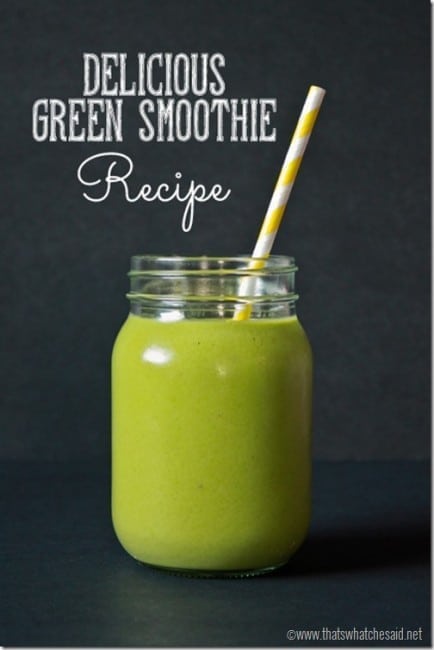green smoothie in mason jar with straw