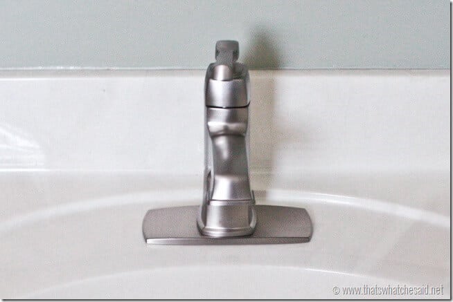 Place the faucet dropping down the water lines through the center whole