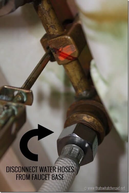 Disconnect water hoses from faucet base