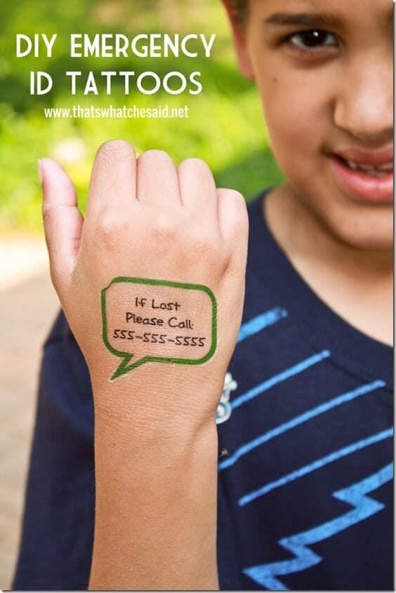 Child wearing safety custom temporary tattoo with phone number to call in case of separation