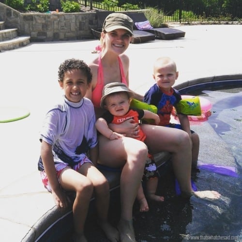 Picture of mom with 3 kids at the pool