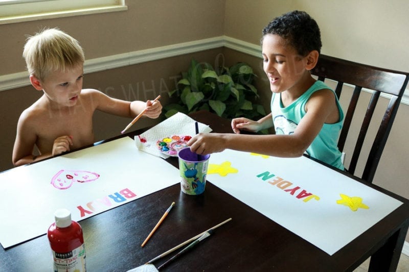 Kids Decorating their poster board pieces for their artwork keepers