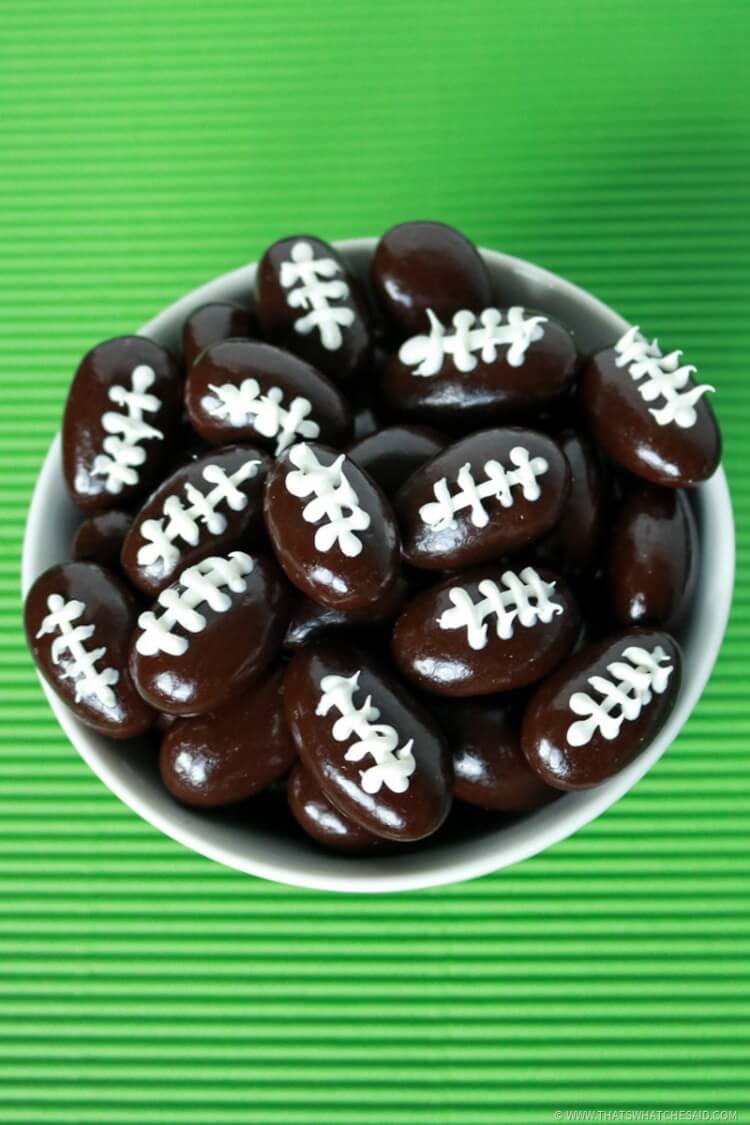 Create fun football treats with chocolate covered almonds icing