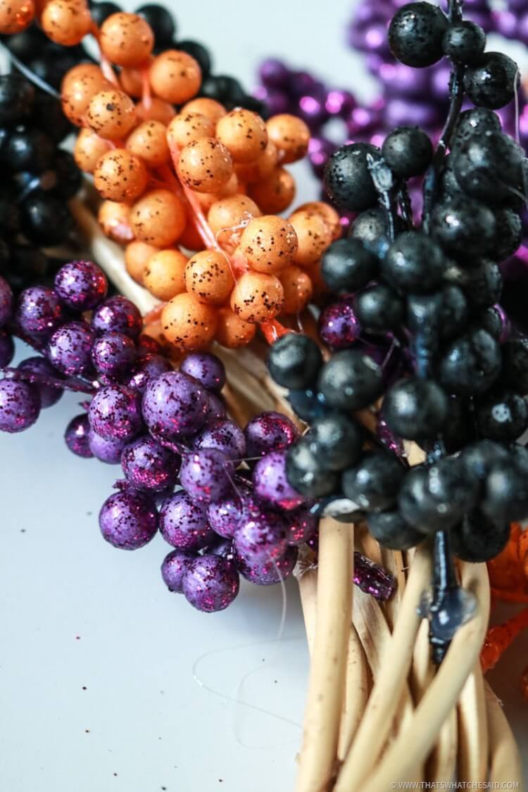 Hot Glue Berry Springs onto Wreath Form for Halloween Wreath