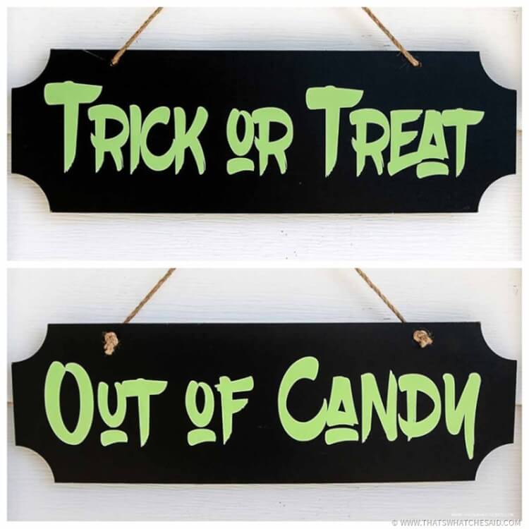 Dual sided out of candy and trick or treat sign