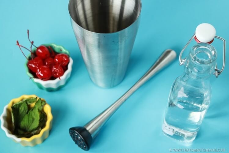 Muddle Cherry, Mint, Simple Syrup together in shaker Muddle Cherry, Mint, Simple Syrup together in shaker