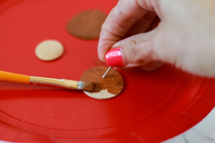 Hold small objects with push pin while painting to avoid painted fingers