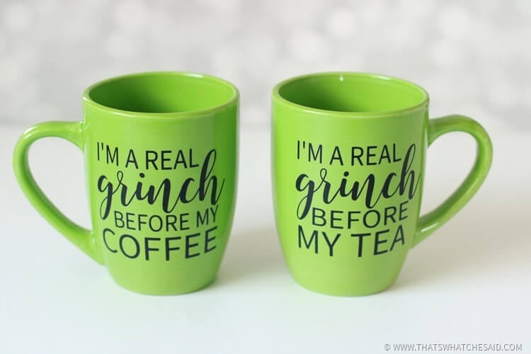 two lime green mugs with a grinch face in adhesive vinyl and sayings "grinch before coffee" or Grinch before tea"