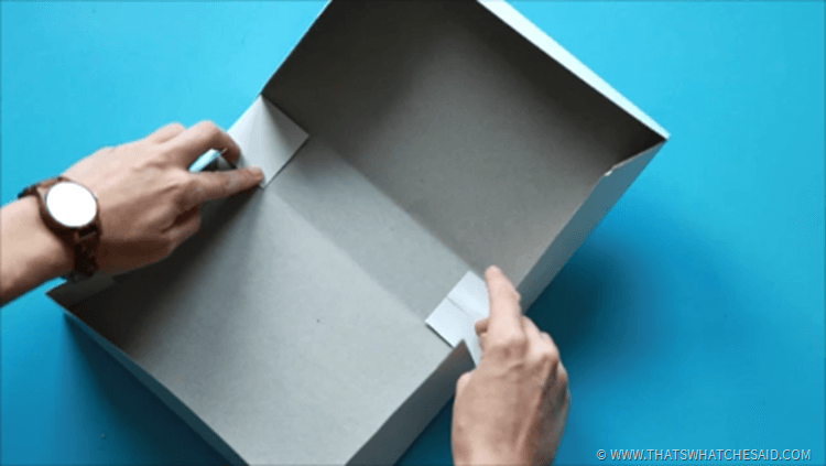folding the flaps into the box