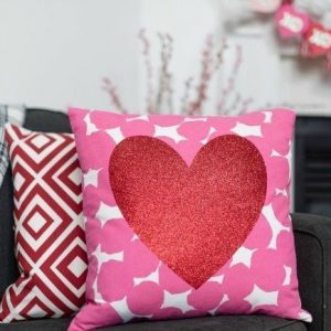 Pink and white pillow with glitter heart