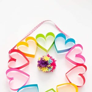 Paper strips made into hearts in a circle to form a wreath