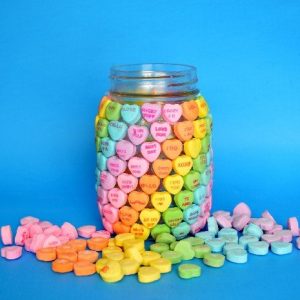 Mason Jar covered in Candy Hearts in Rainbow order