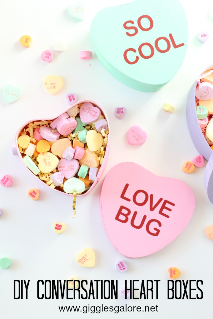 Paper mache heart boxes painted to look like conversation hearts