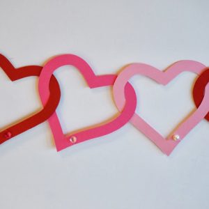 Interlocking paper hearts made into a garland