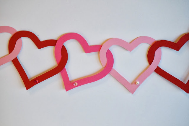 Interlocking paper hearts made into a garland