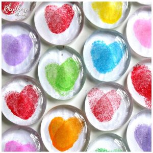 Clear gem magnets with finger prints in the shape of a heart