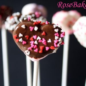 Heart Mashmallows covered in chocolate with sprinkles on sticks
