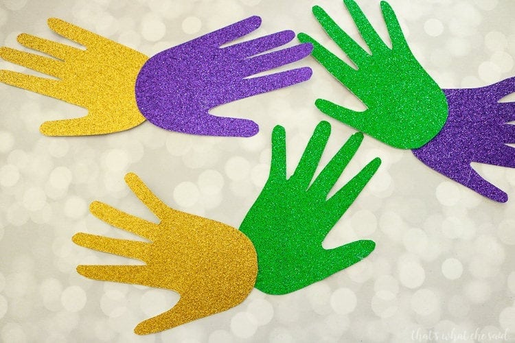 Handprint Mardi Gras Masks - Glue Handprints together to form a mask