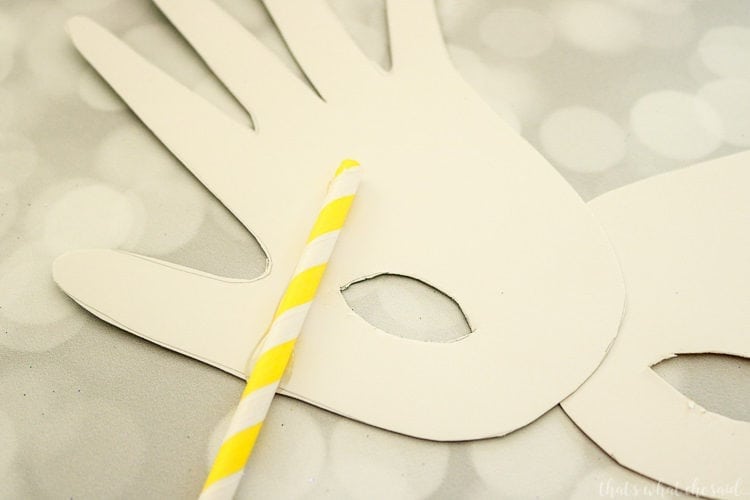 Handprint Mardi Gras Mask - Hot Glue a Paper Straw on the the Mask for a handle