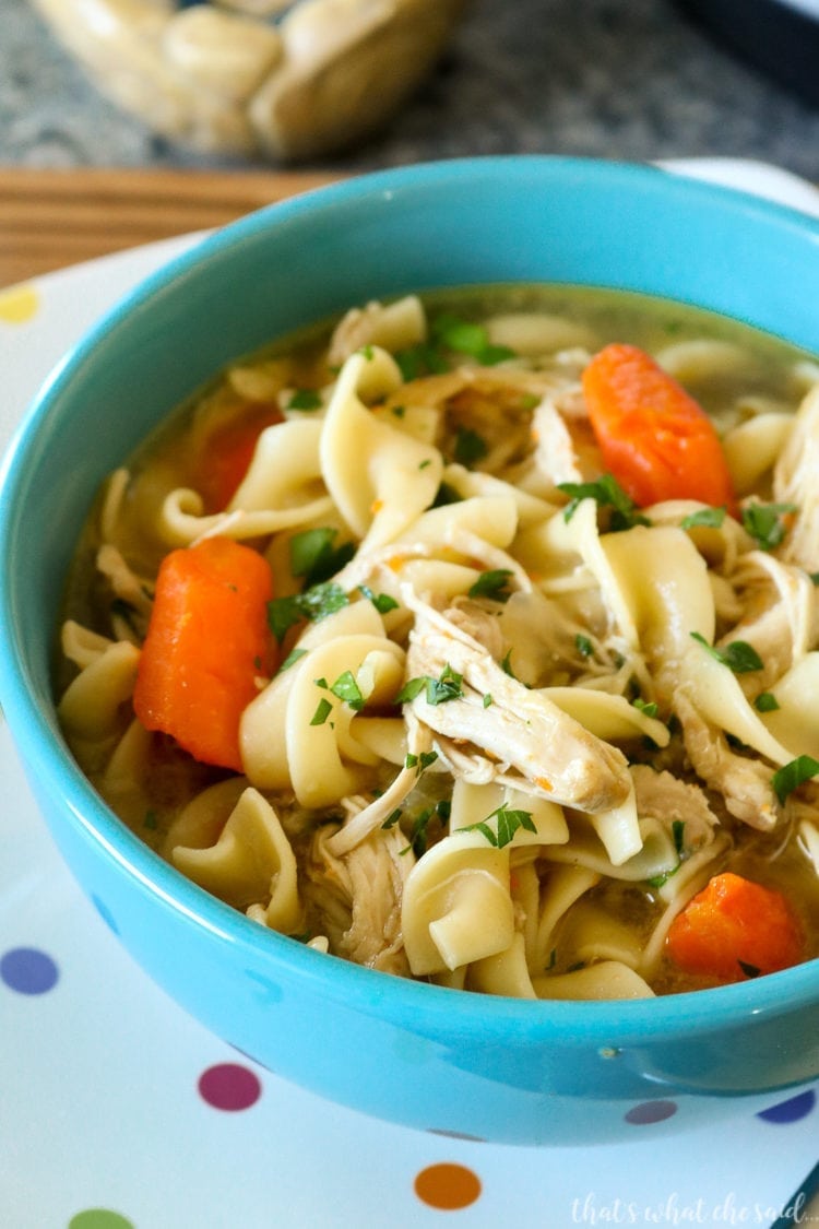 Instant Pot Chicken Noodle Soup in a blue bowl on a polka dot plate