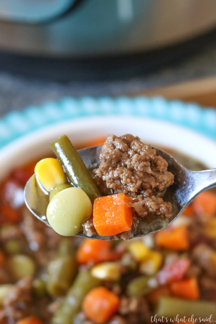 Hearty Veggie Beef Soup made in the Instant Pot - Close up of a spoonful.