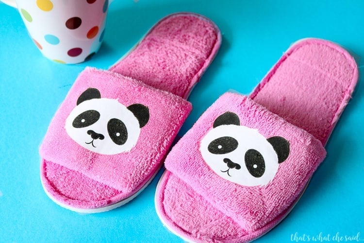 Slippers with Cricut Iron On Designs applied. Pandas on pink slippers