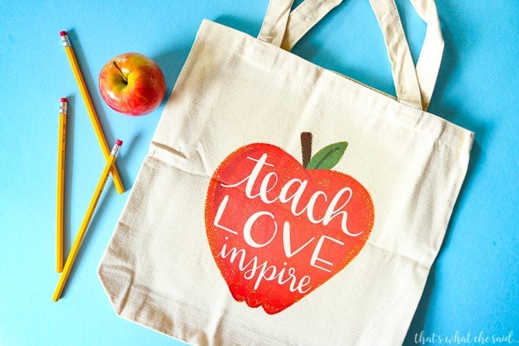 Tote Bag with Teach Love Inspire inside an apple. 