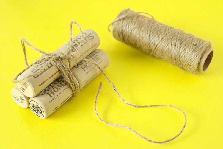 6 corks glued together in pairs and then tied with twine