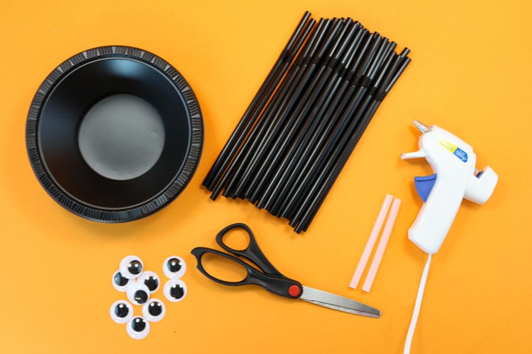 Supplies to Make Spider Treat bowls: Plastic Bowls, Straws, hot glue, googly eyes