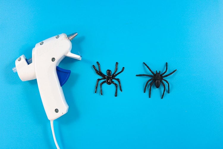 Hot glue gun with hot glue spider and fake spider