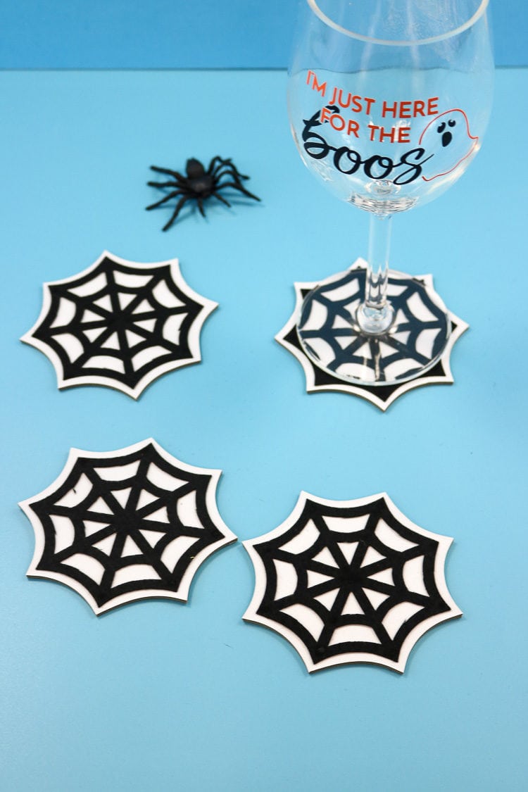 Spider web coasters with wine glass