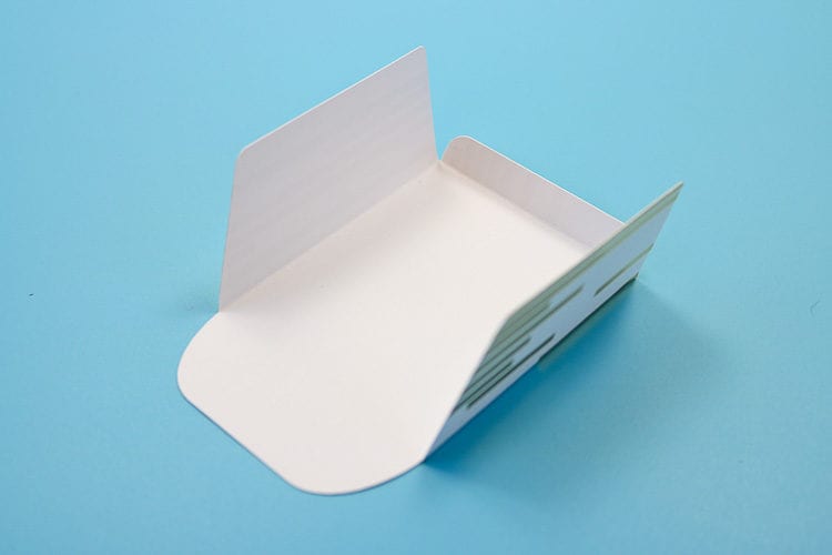 Cardstock Envelope that has folds along the score lines