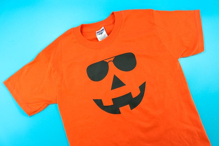 Orange Shirt with Jack-O-Lantern Face wearing Sunglasses