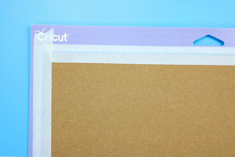 Purple Cricut Mat with Chipboard taped down with masking tape