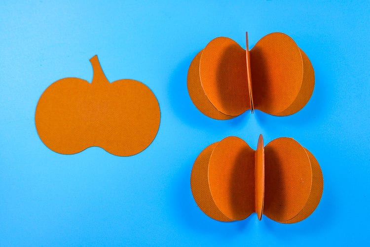 Complete the assembly of the paper pumpkin