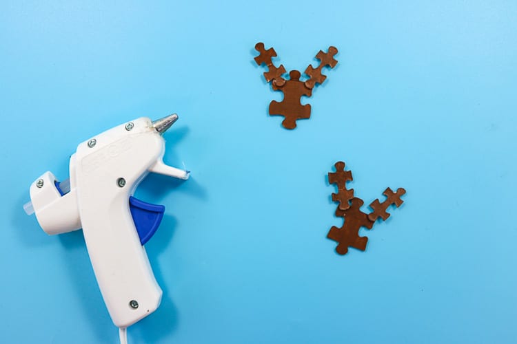Painted Brown Puzzle Pieces glued together to resemble a reindeer