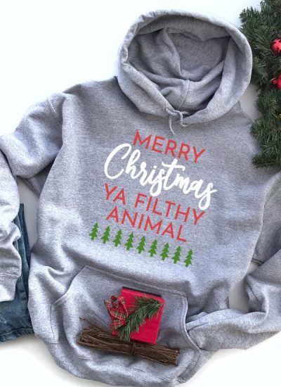 Merry Christmas Ya Filthy Animal SVG file on a Hoodie for Christmas