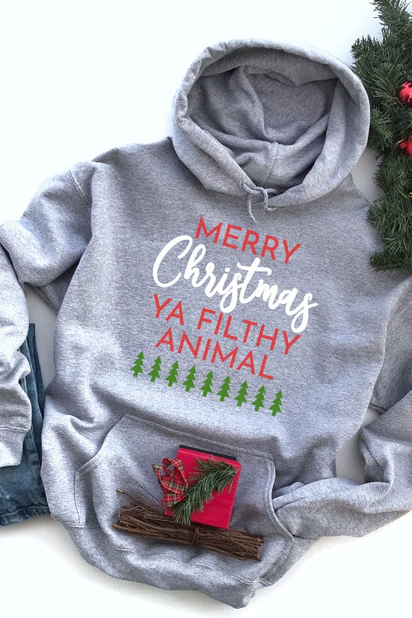 Merry Christmas Ya Filthy Animal SVG file on a Hoodie for Christmas