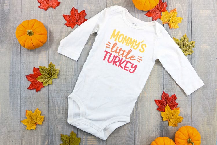 White baby bodysuit with Mommy's Little Turkey in Iron on vinyl