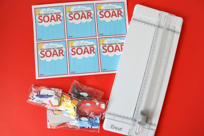 Airplane Class Valentine Card Supplies printable, paper cutter and packages of foam airplanes for airplane valentine cards