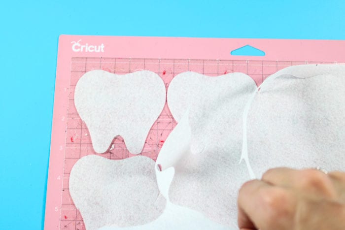 Pink FabricGrip Mat with White Felt. Showing perfectly cut Tooth Designs. 