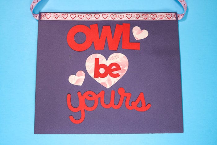 Back of purple envelope valentine box with owl be yours on it with cardstock and patterened iron on