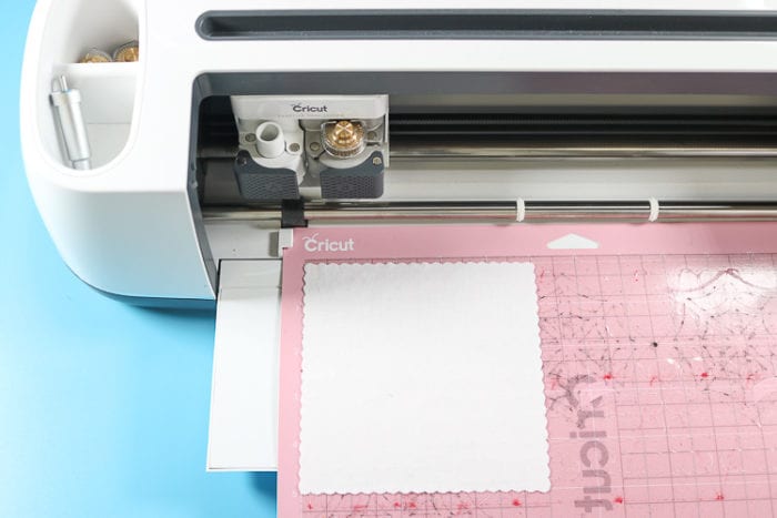 Cricut Maker with FabricGrip mat and white cotton fabric