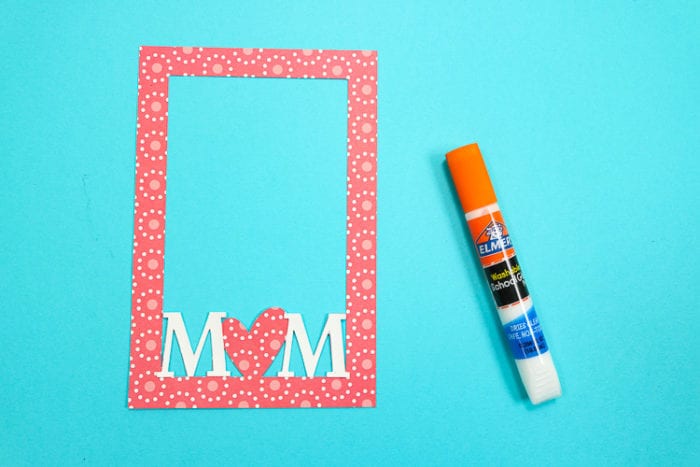 M letters added to the paper frame with elmer's glue