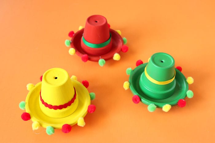 Clay Pots painted and embellished to resemble sombreros for a fiesta party