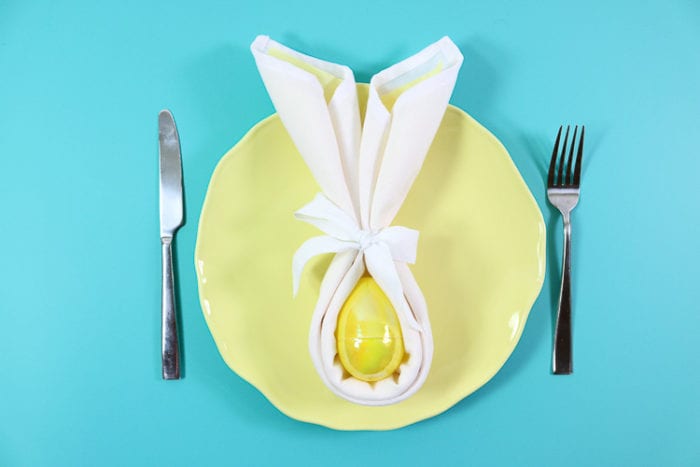 Yellow plate with yellow bunny fold napkin