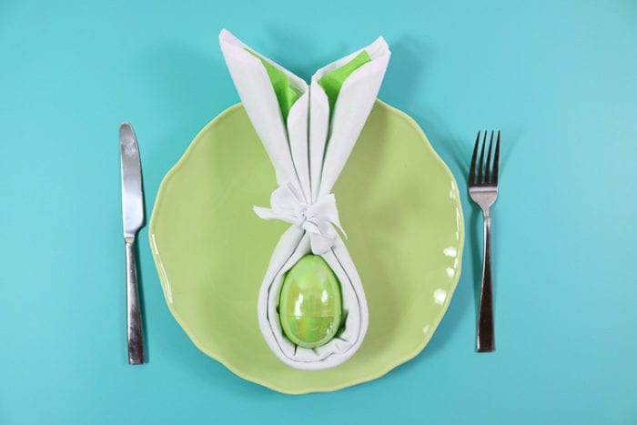 green plate with green folded bunny napkin